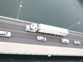 A Challenger transport takes the Pont Cornwall Bridge to Cornwall Island on Tuesday, July 8, 2014. The Seaway International Bridge Corporation opened the North Channel Bridge in Cornwall to pedestrians one last time on Tuesday, July 8, 2014 before future demolition. ERIC HEALEY/CORNWALL STANDARD-FREEHOLDER/Postmedia Network