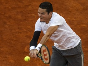 Milos Raonic returns a backhand to Andy Murray during their quarterfinal match at the Madrid Open on Friday, May 8, 2015. (Sergio Perez/Reuters)