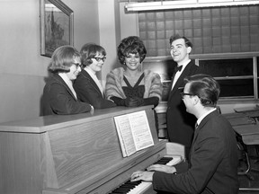 Jazz singer Phyllis Marshall, centre, was flanked by Sir Adam Beck secondary school glee club singers Joyce Laidlaw, left, and Lynne Hartman and opera singer David Geary and pianist Gerald Fagan at a benefit event at H.B. Beal secondary school on April 27, 1965. (London Free Press negative collection/Western Archives)