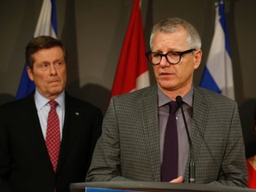 Liberal MP Adam Vaughan (front) and Mayor John Tory at City Hall on Friday. (JACK BOLAND, Toronto Sun)
