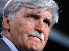 Senator Romeo Dallaire takes part in a news conference on Parliament Hill in Ottawa May 28, 2014. Dallaire, a retired lieutenant-general and former commander of the U.N. peacekeeping forces in Rwanda, announced he will retire from the Senate on June 17. REUTERS/Chris Wattie
