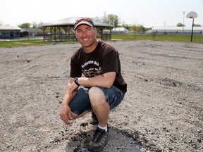 Luke Hendry/The Intelligencer
Shawn Trudeau crouches on what will soon be the Emily Trudeau Splash Pad in Tweed Friday. "This project has really brought everyone together," he said of the community response to the project, which began just two months after his seven-year-old niece died in an accident.