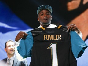 Dante Fowler Jr. of the Florida Gators holds up Jacksonville Jaguars jersey after being chosen third overall in the 2015 NFL draft at the Auditorium Theatre of Roosevelt University on April 30, 2015 in Chicago. (Jonathan Daniel/Getty Images/AFP)