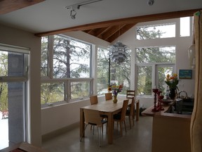 These giant windows in Jamie and Sharon Thompson’s home in Boonie Doon help keep the house warm in the winter.