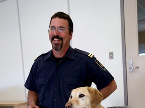 Roger Huneault with his drug detector dog Nico at Joyceville Institution, north of Kingston, on Monday. (Ian MacAlpine/The Whig-Standard)