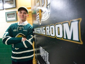 Matthew Tkachuk poses for a photo at the doorway to the London Knights dressing room after signing with the junior hockey team at Budweiser Gardens in London, Ont. on Friday May 8, 2015. (CRAIG GLOVER, The London Free Press)