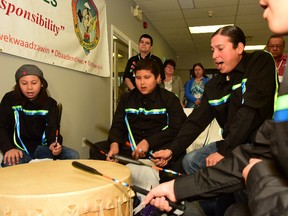 The Young Thunderbird Singers, based at Sudbury's Shkagamik-Kwe Health Centre, closed Friday's designation ceremony at Kina Gbezhgomi Child and Family Services with a song and a little drumming. (Mary Katherine Keown/The Sudbury Star)