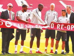 Left to right, MLSE’s Larry Tanenbaum, TFC players Ashtone Morgan, Jozy Altidore, Michael Bradley, Sebastian Giovinco and MLSE head honcho Tim Leiweke help cut the ribbon at BMO Field on Friday ahead of Sunday’s home opener against the Houston Dynamo. (JACK BOLAND/Toronto Sun)