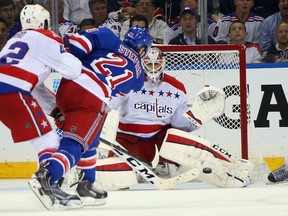Braden Holtby of the Washington Capitals makes a save on Derek Stepan of the New York Rangers during Game 5 of the Eastern Conference semifinals Friday at Madison Square Garden in New York. (Bruce Bennett/Getty Images/AFP)