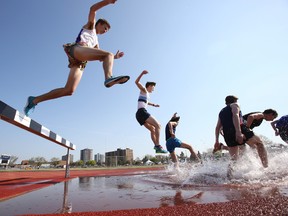 This year's Michelle Foley Bay of Quinte Track and Field meet is on at the Bruce Faulds Track in Belleville, Ont., starting with the boys steeplechase race Friday, May 8, 2015. -  Jerome Lessard/Belleville Intelligencer/Postmedia Network