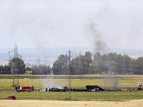 The remains of Airbus A400M are seen after crashing in a field near the Andalusian capital of Seville on May 9, 2015. (REUTERS/Marcelo del Pozo)
