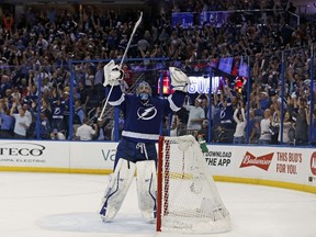 Ben Bishop of the Tampa Bay Lightning celebrates as the team's goal against the Montreal Canadiens is confirmed in Game 3 of the Eastern Conference semifinals during the 2015 NHL playoffs at Amalie Arena on May 6, 2015. (Mike Carlson/Getty Images/AFP)