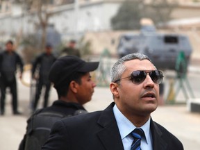 Al Jazeera journalist Mohamed Fahmy is seen outside of a court before a hearing in his trial in Cairo, February 23, 2015. The court adjourned to March 8 the trial of two Al Jazeera television journalists, Mohamed Fahmy and Baher Mohamed, charged with aiding a terrorist organisation - a reference to Mursi's since banned Muslim Brotherhood. Egyptian authorities accuse Qatar-based Al Jazeera of being a mouthpiece of the Muslim Brotherhood -- the movement President Abdel Fattah al-Sisi removed from power in 2013. Al Jazeera denies the allegations. The journalists who were detained in December 2013 said they were doing their jobs. REUTERS/Asmaa Waguih