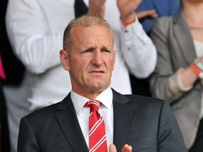 Southampton's Canadian chairman Ralph Krueger looks on before the English Premier League football match between Southampton and Newcastle United at St Mary's Stadium in Southampton on September 13, 2014. (AFP PHOTO/GLYN KIRK)