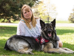 Shawna Church Roy and her service dog "Bauer" on Friday May 8, 2015. Errol McGihon/Ottawa Sun/Postmedia Network