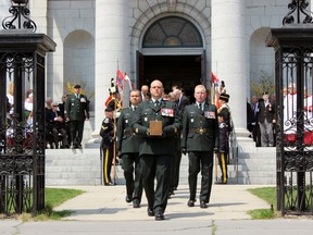 The ashes of Brig.-Gen. (retd.) Sydney "Rad" Radley-Walters exiting the Anglican Cathedral Church of St. George in Kingston, Ont. on Saturday May 9, 2015 after his funeral. Steph Crosier/Kingston Whig-Standard/Postmedia Network