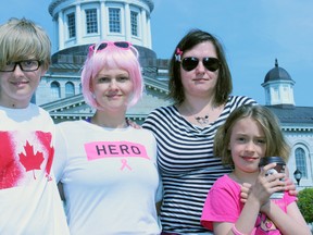 From left, Noa Proulx, with his mother Eliza Koscielewska, her sister Blanka LaFleur, and her daughter Belle LaFleur, at the  Breast Cancer Action Walk/Run at Confederation Park in Kingston, Ont. on Saturday May 9, 2015. Koscielewska was diagnosed with breast cancer earlier this year.  Steph Crosier/Kingston Whig-Standard/Postmedia Network