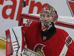 Ottawa Senator Craig Anderson keeps his eyes on the puck during third period action at the Canadian Tire Centre in Ottawa Wednesday April 22, 2015. The Ottawa Senators defeated the Montreal Canadiens 1-0 Wednesday. Tony Caldwell/Postmedia Network