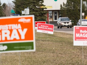 Election signs are seen in the Edmonton - Mill Woods riding are seen along 28 Avenue near 50 Street in Edmonton, Alta., on Tuesday April 14, 2015. Ian Kucerak/Postmedia Network