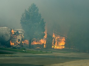 Photographed by Peace Officer Mark R. Becker, Enforcement Services, Slave Lake, after the wildfire entered the town on May 15, 2011. Becker was in the town as fire ravaged 100's of houses and business in the wildfire.