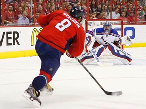 Washington Capitals left winger Alex Ovechkin shoots the puck on New York Rangers goalie Henrik Lundqvist in the second period in Game 4 of the second round of the 2015 NHL playoffs at Verizon Center on May 6, 2015. (Geoff Burke/USA TODAY Sports)