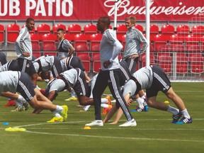 Toronto FC players stretch before practice on Friday at the newly renovated BMO Field. The Reds take on the Houston Dynamo on Sunday. (JACK BOLAND/Toronto Sun)