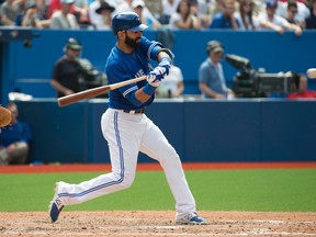 Blue Jays designated hitter Jose Bautista (19) hits a single to score a run during the sixth inning in a game against the Boston Red Sox at Rogers Centre on May 9, 2015. (NICK TURCHIARO/USA TODAY Sports)