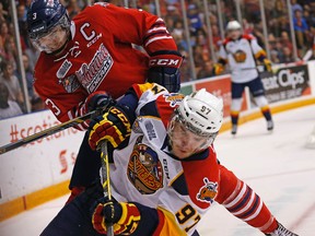 Erie's captain Connor McDavid collides with Oshawa's captain John Brown in as Oshawa Generals defeated Erie Otters 5-1 in Game 2 of OHL finals in Oshawa on Saturday May 9, 2015. Michael Peake/Toronto Sun/Postmedia Network