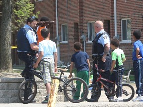 Toronto Community Housing special constables maintained a presence in the Danzig St. townhouse complex Saturday, May 10, 2015  after a woman was found slain the night before. CHRIS DOUCETTE/TORONTO SUN