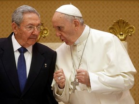 Pope Francis, right, talks with Cuban President Raul Castro during a private audience at the Vatican on May 10, 2015. (REUTERS/Gregorio Borgia/Pool)