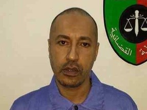 Saadi Gadhafi, son of Moammar Gadhafi, looks on inside a prison in Tripoli in this handout photograph provided by the prison's relations department on March 6, 2014. (REUTERS/Prison Media Office/Handout via Reuters)
