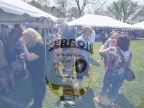 More than 50 vendors are showcased at this year's 'Terroir, Wine and Farmers Market' — a farm-to-table experience showcasing local food, handcrafted wine, artisan bread, preserves and other products from local farmers, shown here in a double-exposure photograph — at Crystal Palace in Picton, Ont. Saturday, May 9, 2015. -  Jerome Lessard/Belleville Intelligencer/Postmedia Network