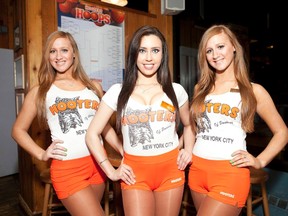 Hooters Host Twins Brittany & Whittany Braswell  and Hooters Calandar Girl Christina Villar.
Jeff Grossman/WENN.com