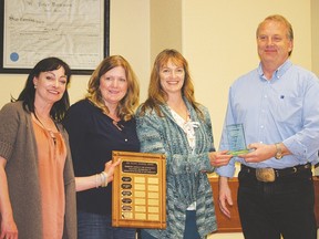 From left, Barbara Moore-Coffey, chair of the Vulcan and District Recreation Committee, Bonnie Ellis, Town of Vulcan recreation director, Joanne Kettenbach, vice chair of the Vulcan and District Recreation Committee and Ted Findlay, recipient of the 2014 Ron Pelham Award.