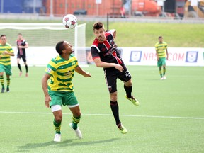 Ottawa Fury FC striker Andrew Wiedeman jumps for a ball during Saturday's game against the Rowdies at TD Place. (Chris Hofley/Ottawa Sun)​​