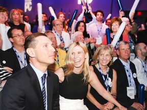 Patrick Brown, left, with his family sitting next to him as he wins the PC leadership in Toronto, defeating Christine Elliott on Saturday. (Veronica Henri/Postmedia Network)