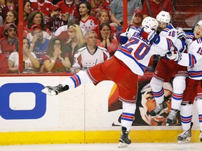 New York Rangers left wing Chris Kreider celebrates with teammates after scoring a goal against the Washington Capitals in the first period in Game 6 of the second round of the 2015 NHL playoffs at Verizon Center on May 10, 2015. (Geoff Burke/USA TODAY Sports)