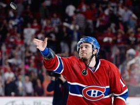 Canadiens forward Pierre-Alexandre Parenteau throws an autographed puck to fans after being named the first star of Game 5 on Saturday night against Tampa. Montreal trails the Eastern Conference series 3-2 after digging itself out of a 3-0 hole. (USA Today Sports)