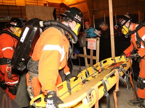 Team members from Vale West Mines compete in a mine rescue competition at the Jim Coady Memorial Arena in Levack on Friday. Winners of the competition move on to the annual Ontario Mine Rescue Provincial Competition, which takes place June 10-11 in Thunder Bay. (John Lappa/Sudbury Star)