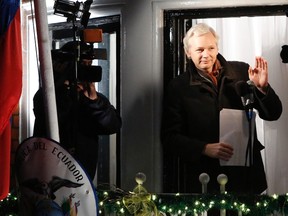 WikiLeaks founder Julian Assange gestures from the balcony of Ecuador's Embassy as he makes a speech in central London, in this file photograph dated Dec. 20, 2012. (Reuters)