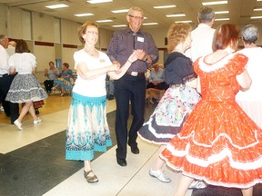 Janet Whitlock and Jim Macleod take part in the Wallaceburg Baldoon Squares' last event on May 6 at Wallaceburg District Secondary School. The Wallaceburg square dance club has decided to fold after 45 years. Photo taken Wednesday, May 6, 2015 at Wallaceburg, Ontario. (DAVID GOUGH, Postmedia Network)