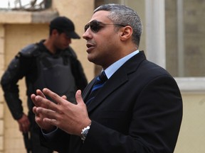 Al Jazeera journalist Mohamed Fahmy is seen outside of a court before a hearing in his trial in Cairo, Feb. 23, 2015. REUTERS/Asmaa Waguih