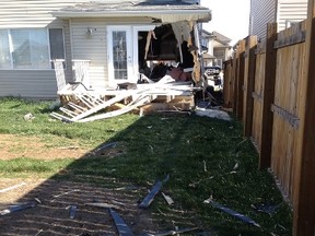 No one was hurt when this Jeep slammed into a northside home. Tom Braid/Edmonton Sun
