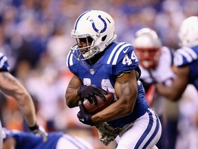 Ahmad Bradshaw #44 of the Indianapolis Colts runs the ball against the New England Patriots during the first half of the game at Lucas Oil Stadium on November 16, 2014 in Indianapolis, Indiana. (Andy Lyons/Getty Images/AFP)