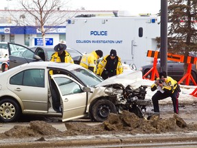 Police are on scene at 76 Avenue and 75 Street after a collision between an unmarked police car and another vehicle this morning left a woman dead in Edmonton on Thursday, March 8, 2012. Alberta Serious Incident Response Team (ASIRT) is investigating the crash. CODIE MCLACHLAN/EDMONTON SUN