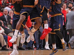 Cleveland Cavaliers forward LeBron James (23) celebrates with teammates after scoring the game winning basket in the second half of game four of the second round of the NBA Playoffs against the Chicago Bulls at the United Center. Dennis Wierzbicki-USA TODAY Sports