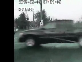 A pickup truck runs a red light in a York Regional Police dashcam video. (YouTube framegrab)