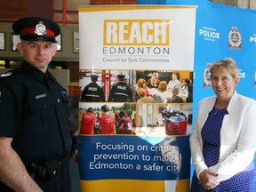 Staff Sgt. Graham Blackburn and Jan Fox, Executive Director, REACH Edmonton help kick-off Crime Prevention Week in Edmonton at Police headquarters on May 11, 2015.Tom Braid/Edmonton Sun/Postmedia Network.