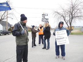 Secondary school teachers picket outside Lively District Secondary School in Sudbury, Ont. on Monday May 11, 2015. There is no end in sight as the strike entered its third week. Gino Donato/Sudbury Star