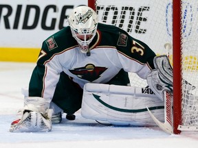 Minnesota Wild's goaltender Josh Harding lets in a goal from Chicago Blackhawks' Marcus Kruger during the second period of Game 5 of their NHL Western Conference quarterfinal playoff series in Chicago on May 9, 2013. (REUTERS/Jeff Haynes)